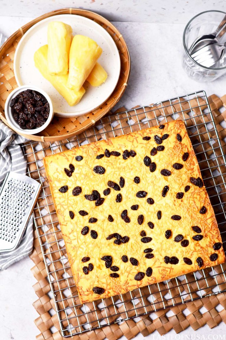 cassava tapai cake (bolu tape) with grated cheddar cheese and raisins