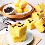 cassava tapai cake (bolu tape) with grated cheddar cheese and raisins