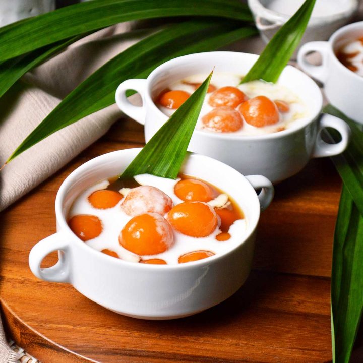 biji salak or indonesian sweet potato balls in palm sugar syrup and drizzled with thick coconut milk