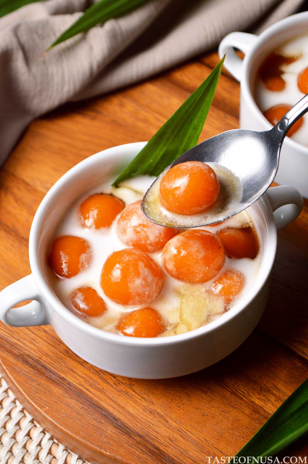 biji salak or indonesian sweet potato balls in palm sugar syrup and drizzled with thick coconut milk