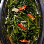 morning glory or water spinach stir fry cooked with shallots, garlic, and oyster sauce