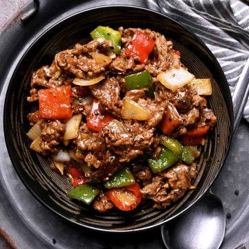 black pepper beef with onion, red bell pepper, and green bell pepper