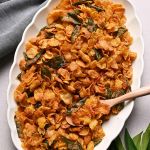 crispy salted egg yolk cornflakes with bird's eye chilis and curry leaves